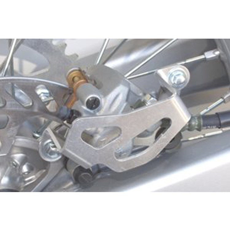 Works Connection Rear Brake Caliper Guard KAWASAKI/SUZUKI KX250F 04-25, KX250XC 20-25, KX450F 06-25, KX450XC 20-23, RMZ250 04-06
